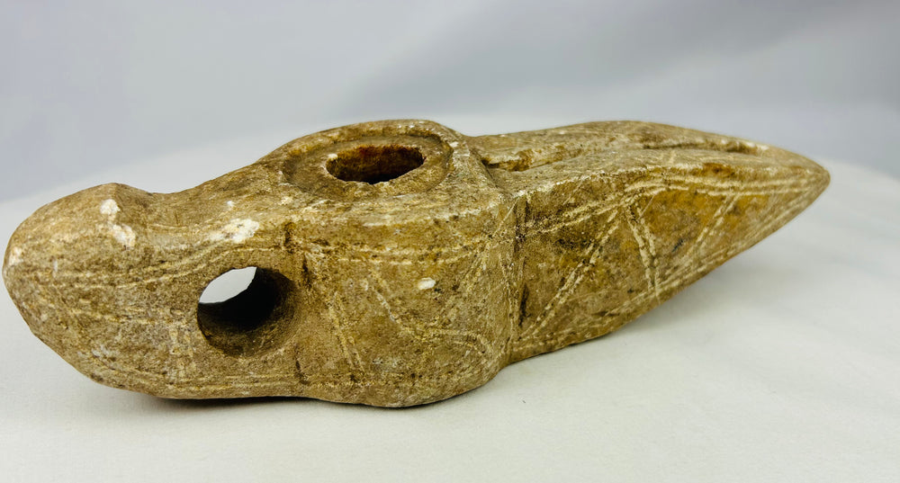 Historic Islamic lighting artifact carved from a single stone block