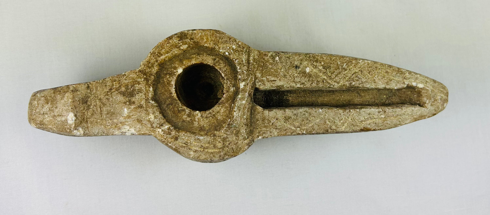 Ancient Islamic lamp with elongated wick channel and carved designs