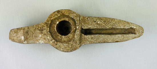 Ancient Islamic lamp with elongated wick channel and carved designs