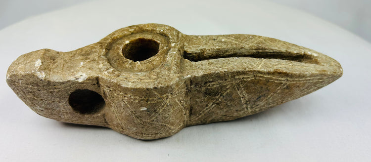 Middle Eastern carved stone lamp showing authentic archaeological surface