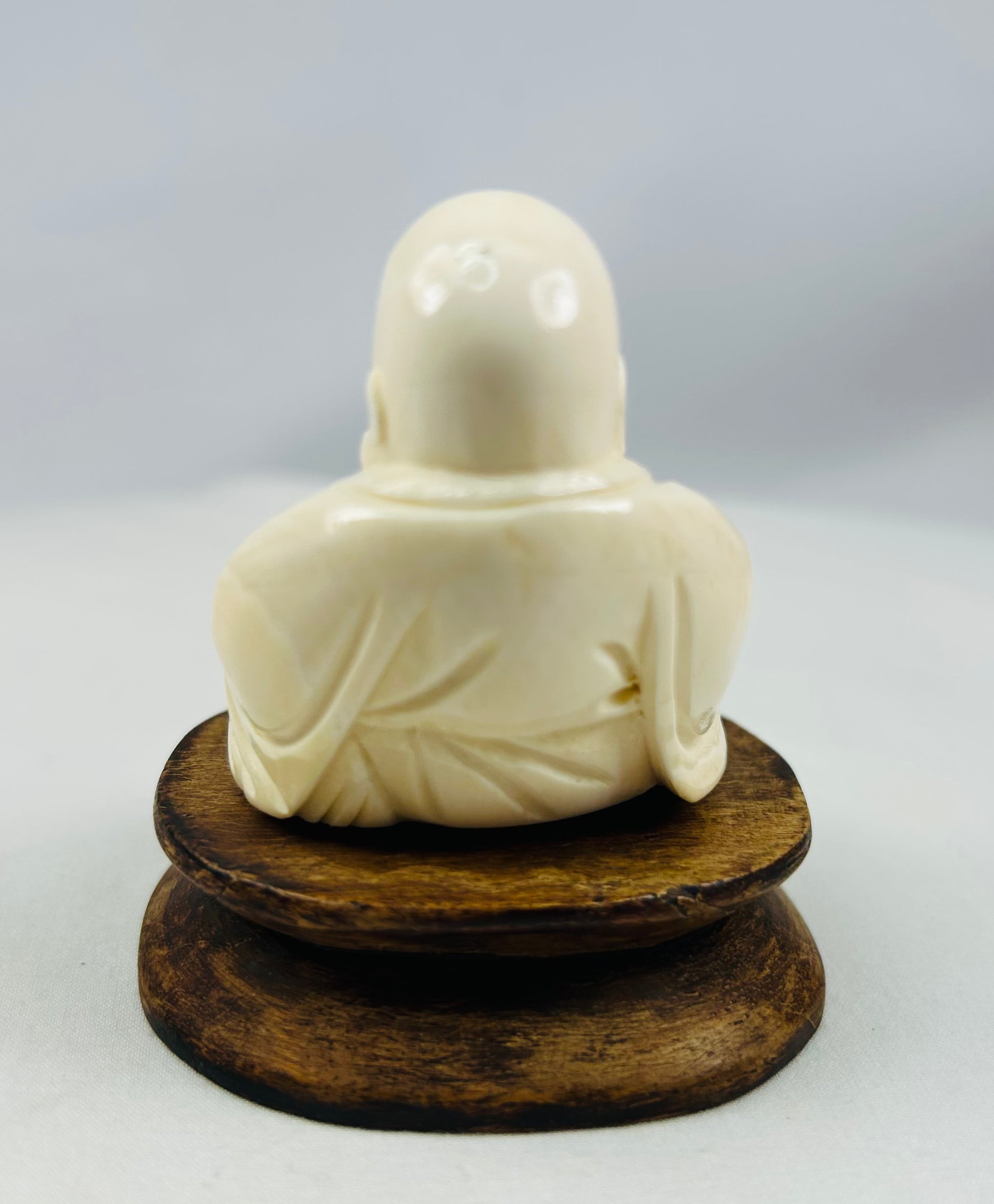 Antique Asian Laughing Buddha sculpture finely detailed with rounded belly
