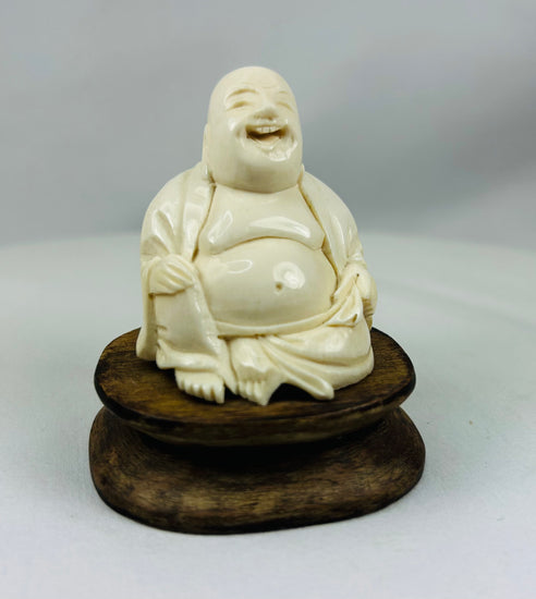 Hand-carved Laughing Buddha statue with joyful expression antique collectible