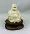 Hand-carved Laughing Buddha statue with joyful expression antique collectible