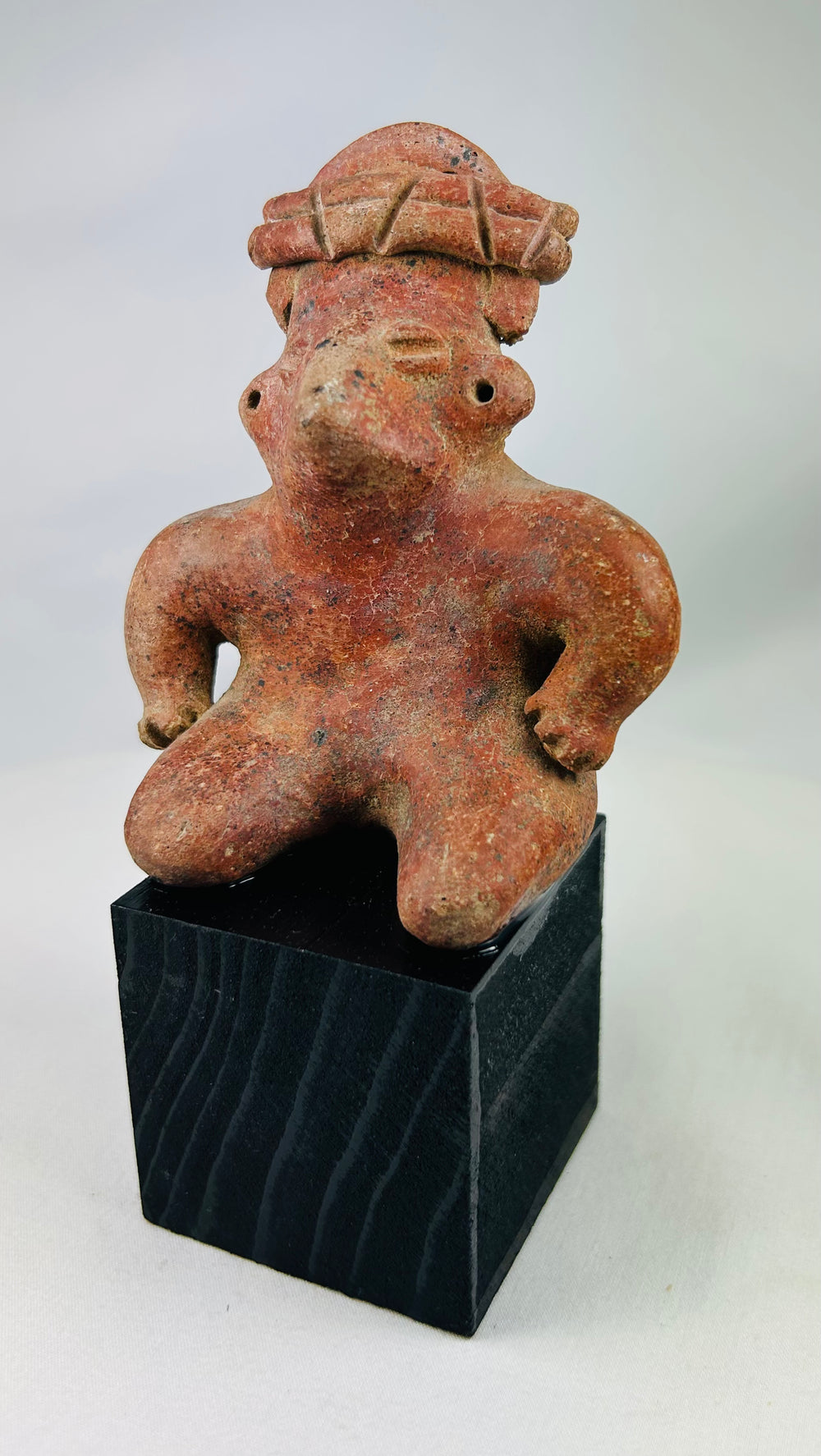Authentic Pre-Columbian terracotta figure with stylized features and red slip
