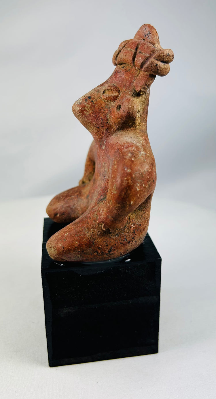 Pre-Columbian terracotta seated figure with powerful sculptural form