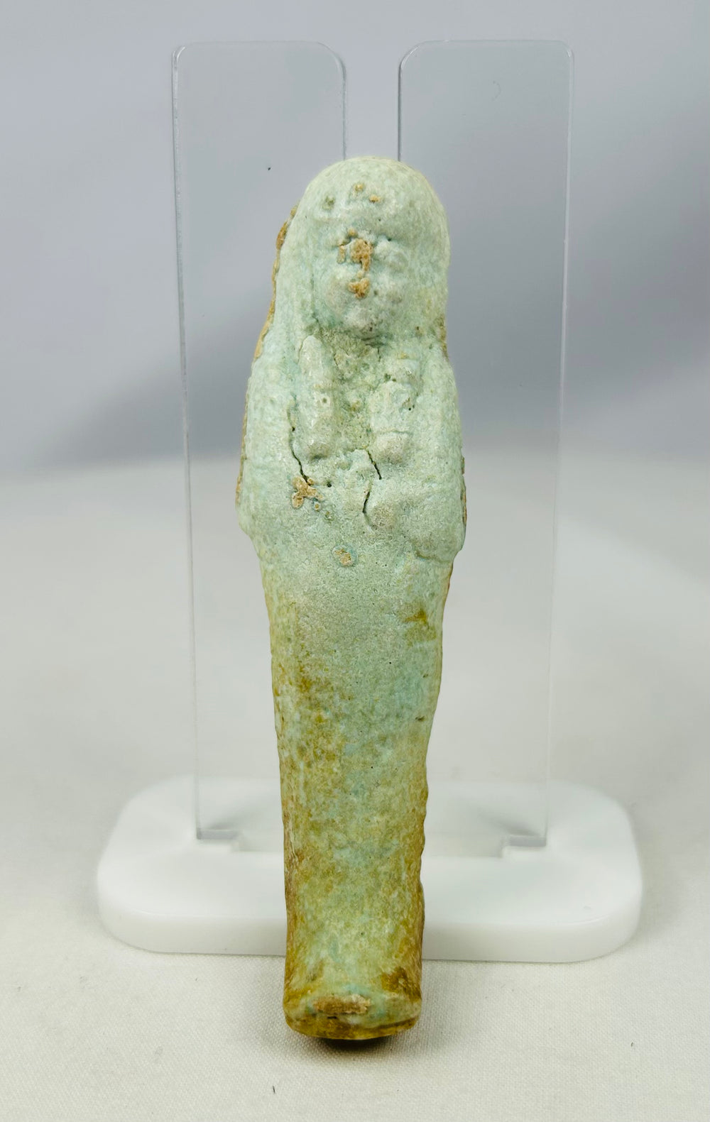 Egyptian Ushabti artifact with mineral inclusions and ancient burial encrustations
