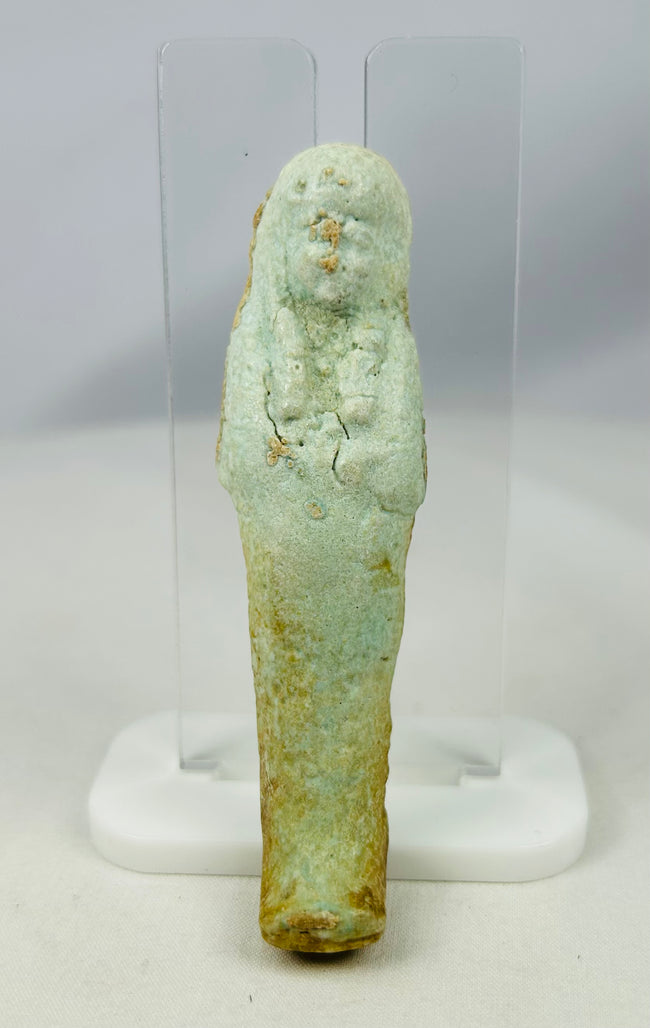 Egyptian Ushabti artifact with mineral inclusions and ancient burial encrustations