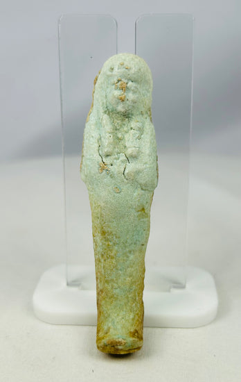 Egyptian Ushabti artifact with mineral inclusions and ancient burial encrustations