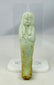 Egyptian Ushabti artifact with mineral inclusions and ancient burial encrustations