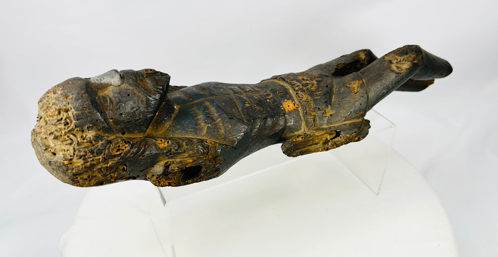 Early Colonial carved wooden Christ relic showing historic erosion and patina