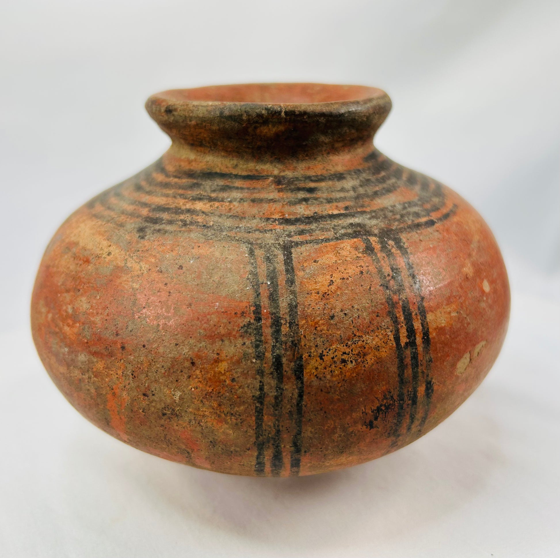 Authentic African tribal clay pot with bold black motif and aged patina