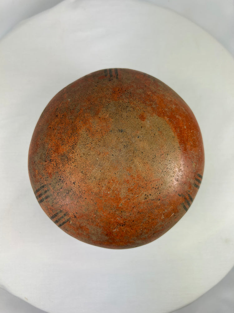 African cultural terracotta pot with traditional geometric surface pattern