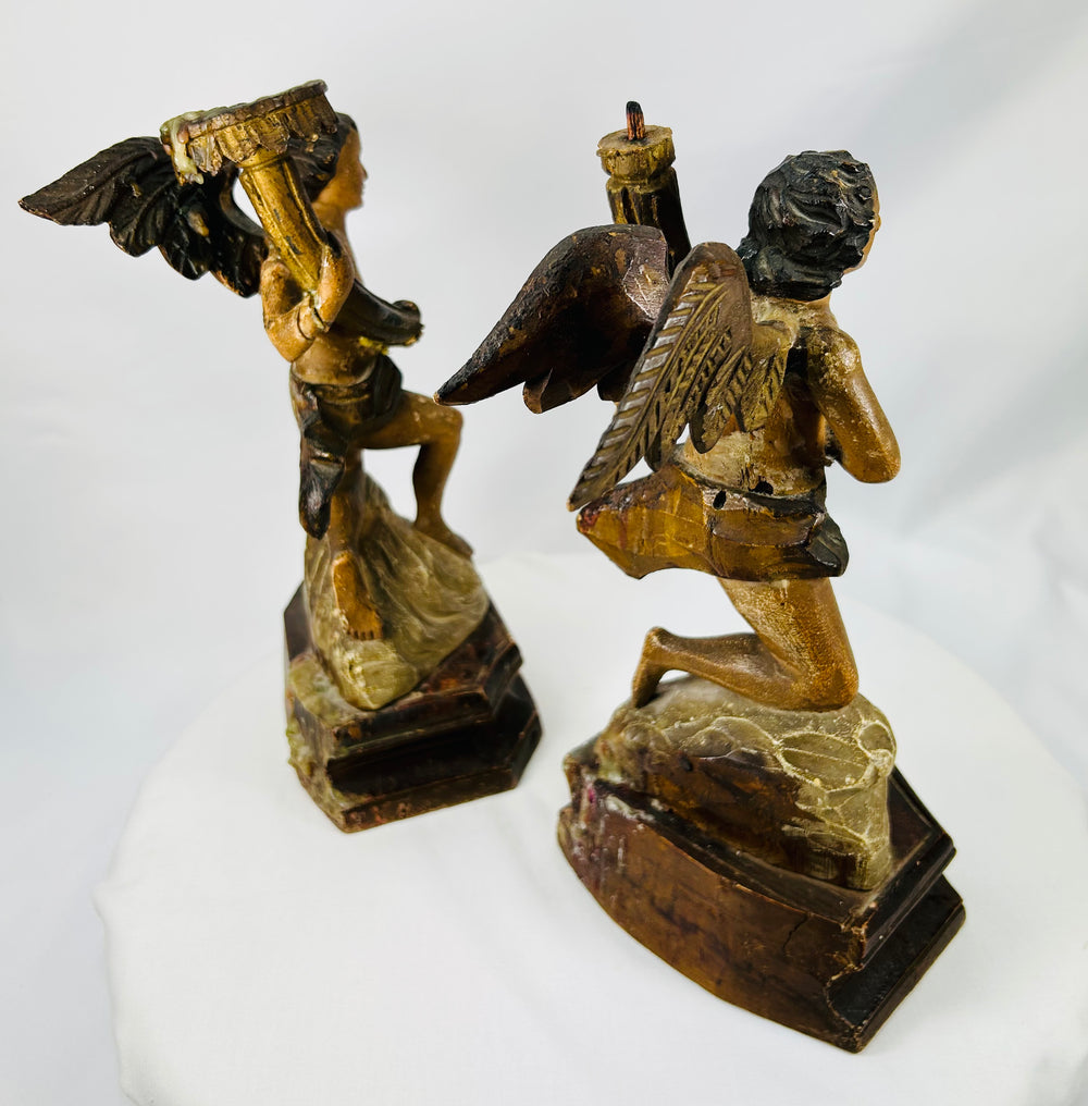 Spanish Colonial or European carved angel figures with worn gilded surfaces