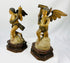 Historic carved wooden angels on cloud bases with Baroque style detailing