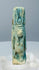 Rear detail of blue-green glaze preserved within the recessed areas of a Taweret figure