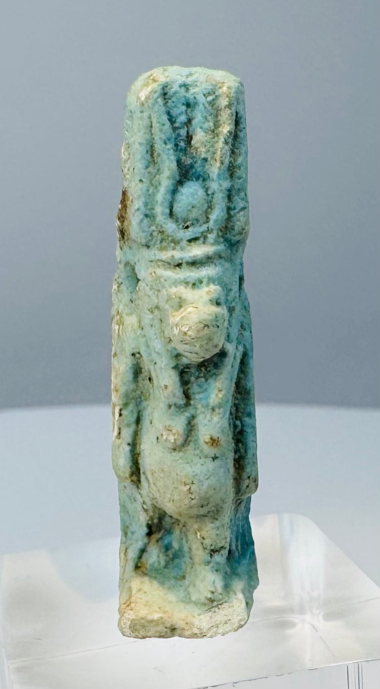 Rear detail of blue-green glaze preserved within the recessed areas of a Taweret figure