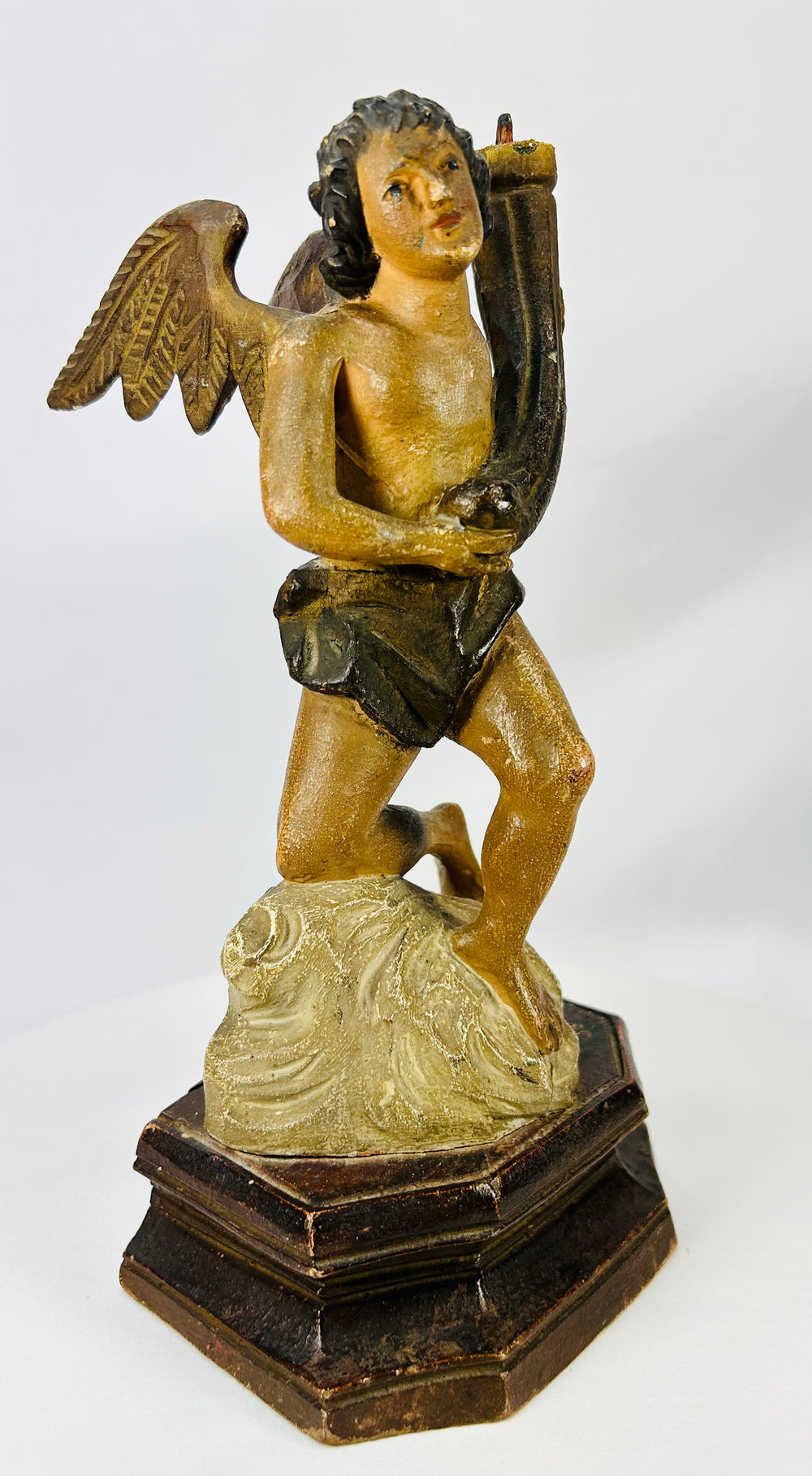 European devotional carved angels with polychrome remnants and aged wear