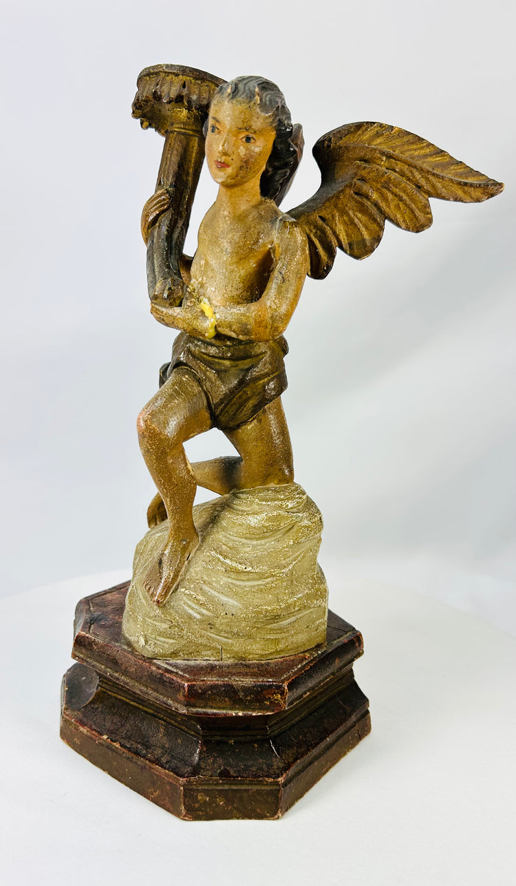 Antique church or chapel angel carvings mounted on tiered octagonal bases