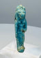 Reverse view of a Late Period faience amulet showing extensive blue-green glaze remnants