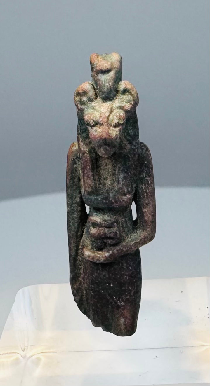 Reverse view of a Late Period faience amulet showing its rear pillar and suspension loop