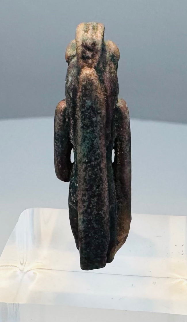 Mold-formed Egyptian faience amulet with brown, burgundy and nearly black coloration