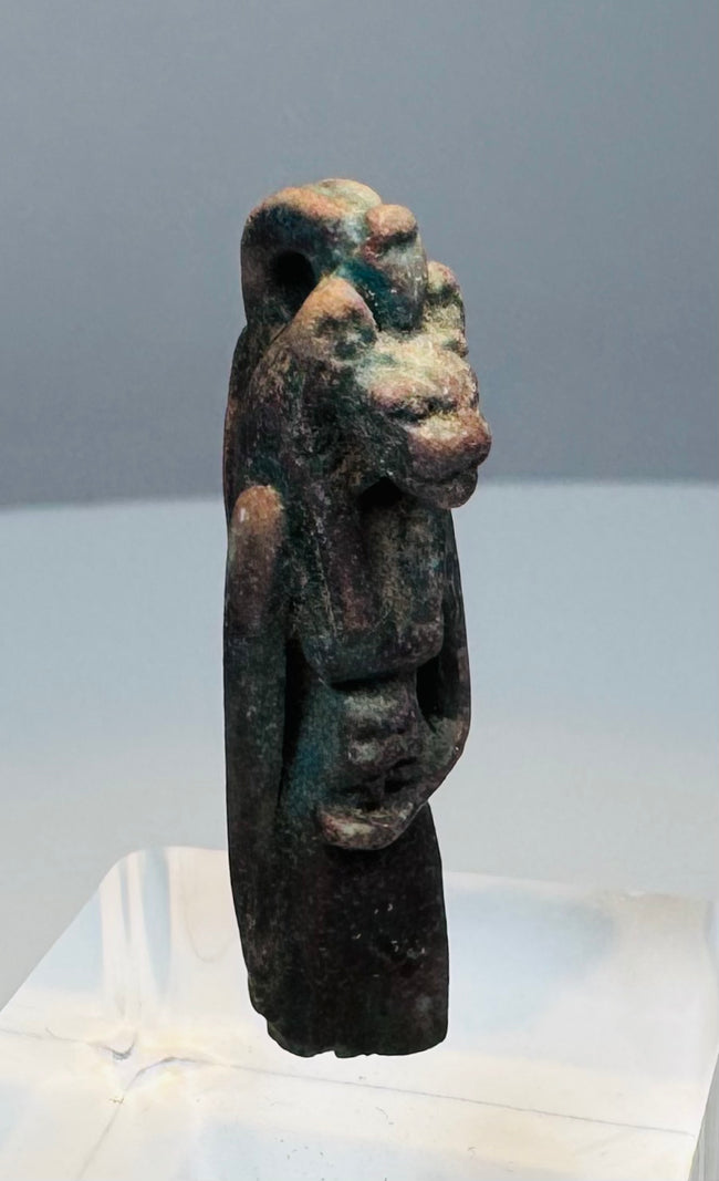 Detail of mineral deposits, encrustation and pitting across the ancient faience surface
