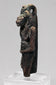 Front view of an Egyptian lioness-headed goddess amulet with dark burial patina
