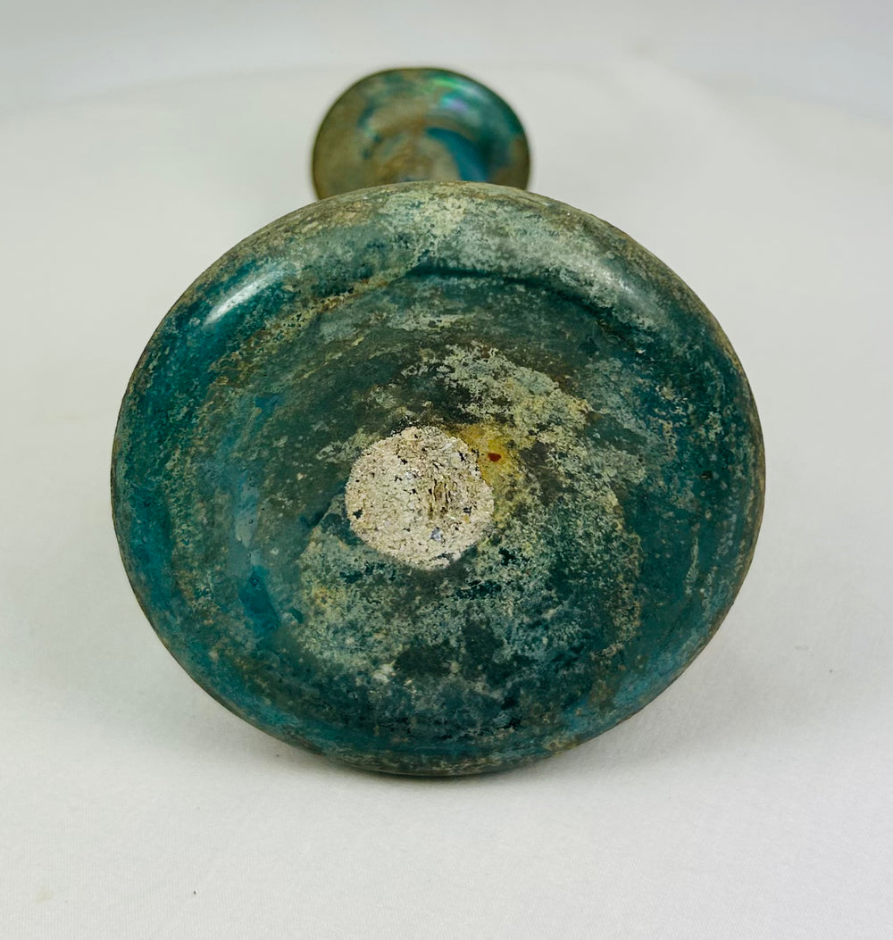 Rare Roman glass collectible with turquoise body and elegant conical form