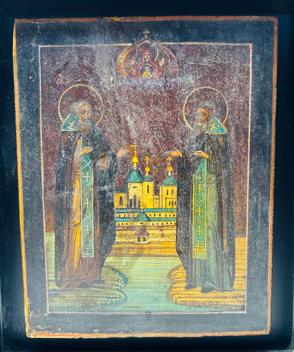 Historic Russian icon of miracle-working monks with heavenly figure above