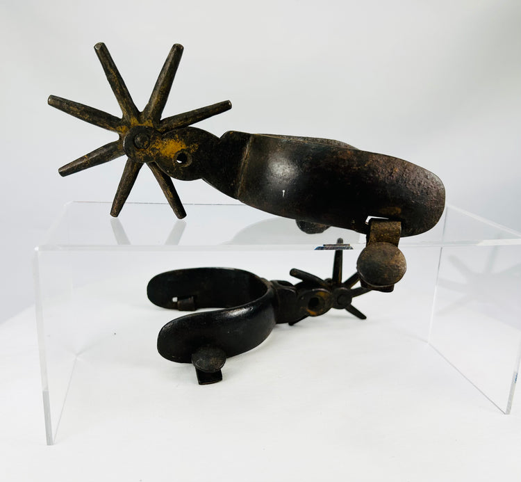 Authentic antique Vaquero style riding spurs showing age patina and wear