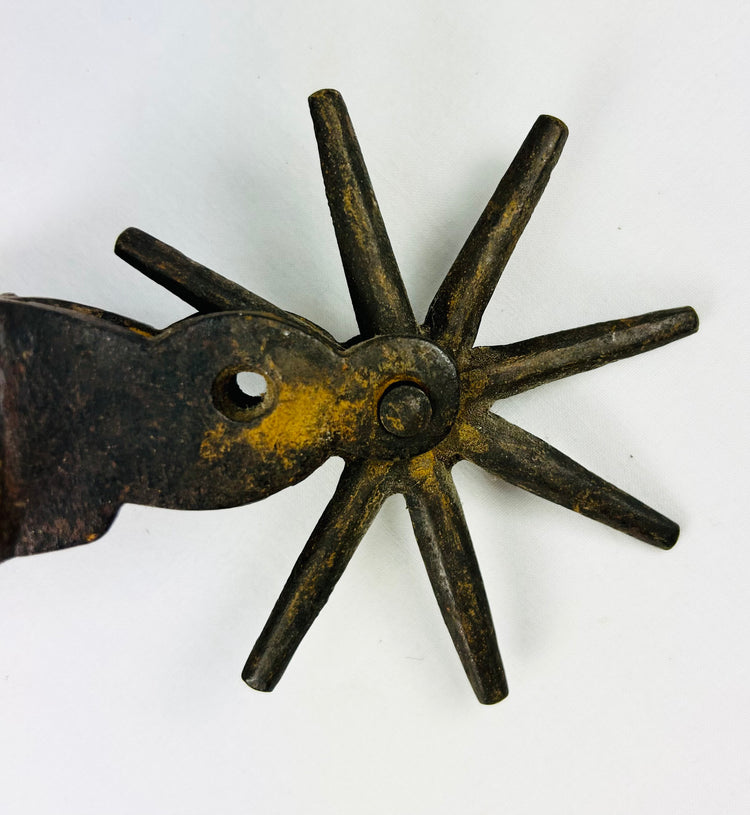 Western collectible antique cowboy spurs with bold forged iron construction