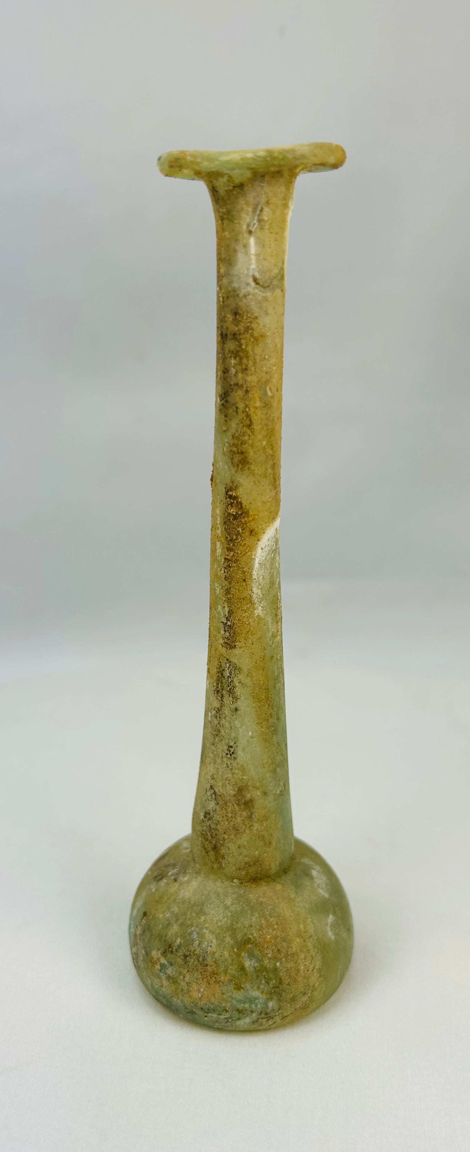 Roman Imperial blown glass vessel with archaeological patina and earthen deposits