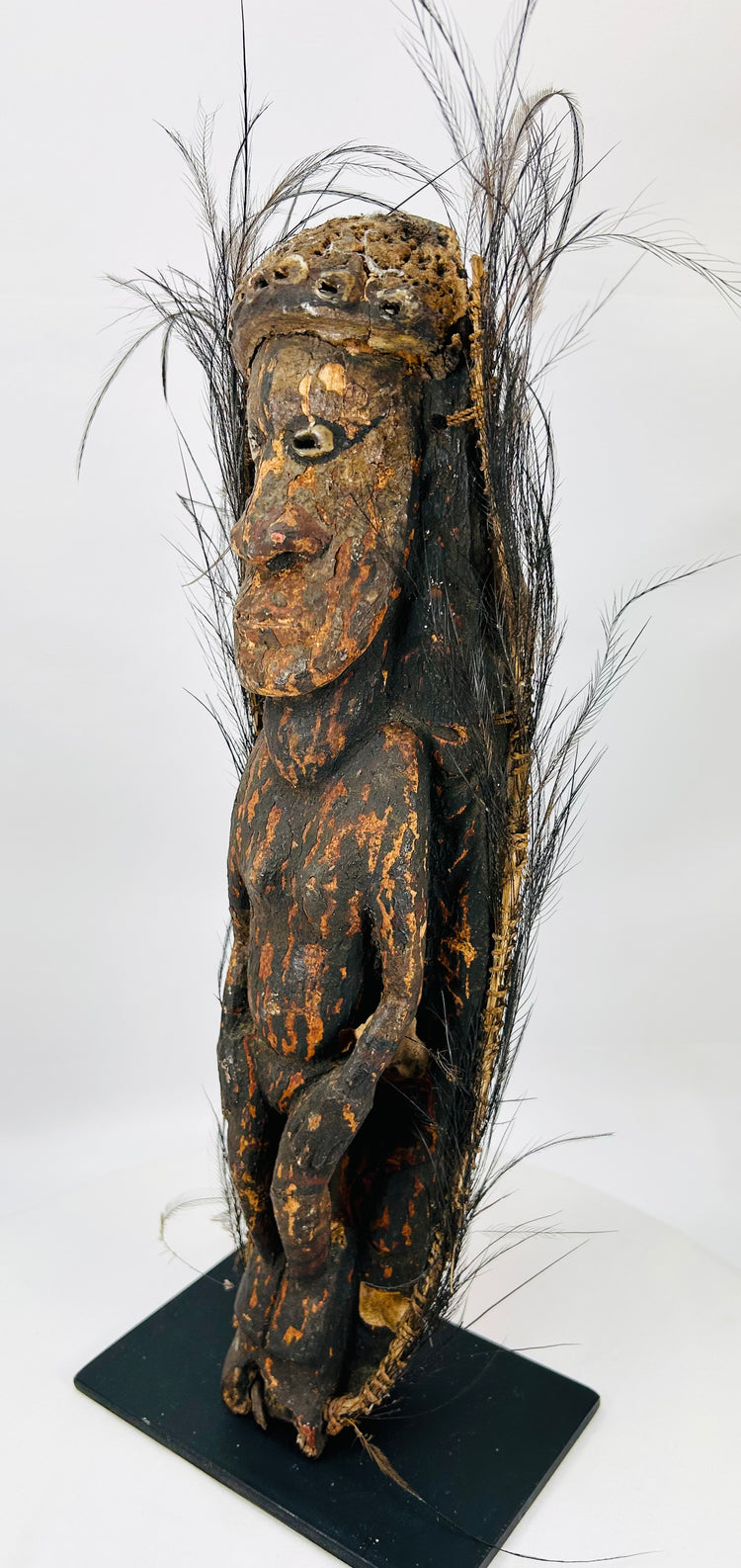 Museum-quality Sepik ancestor figure mounted on display base with cultural detailing