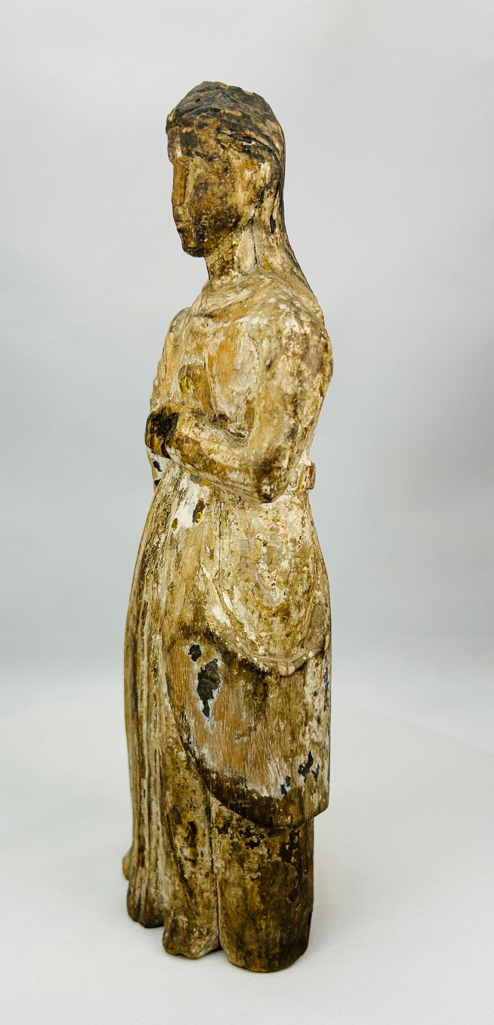 Spanish devotional Virgin Mary sculpture with worn paint and historical patina