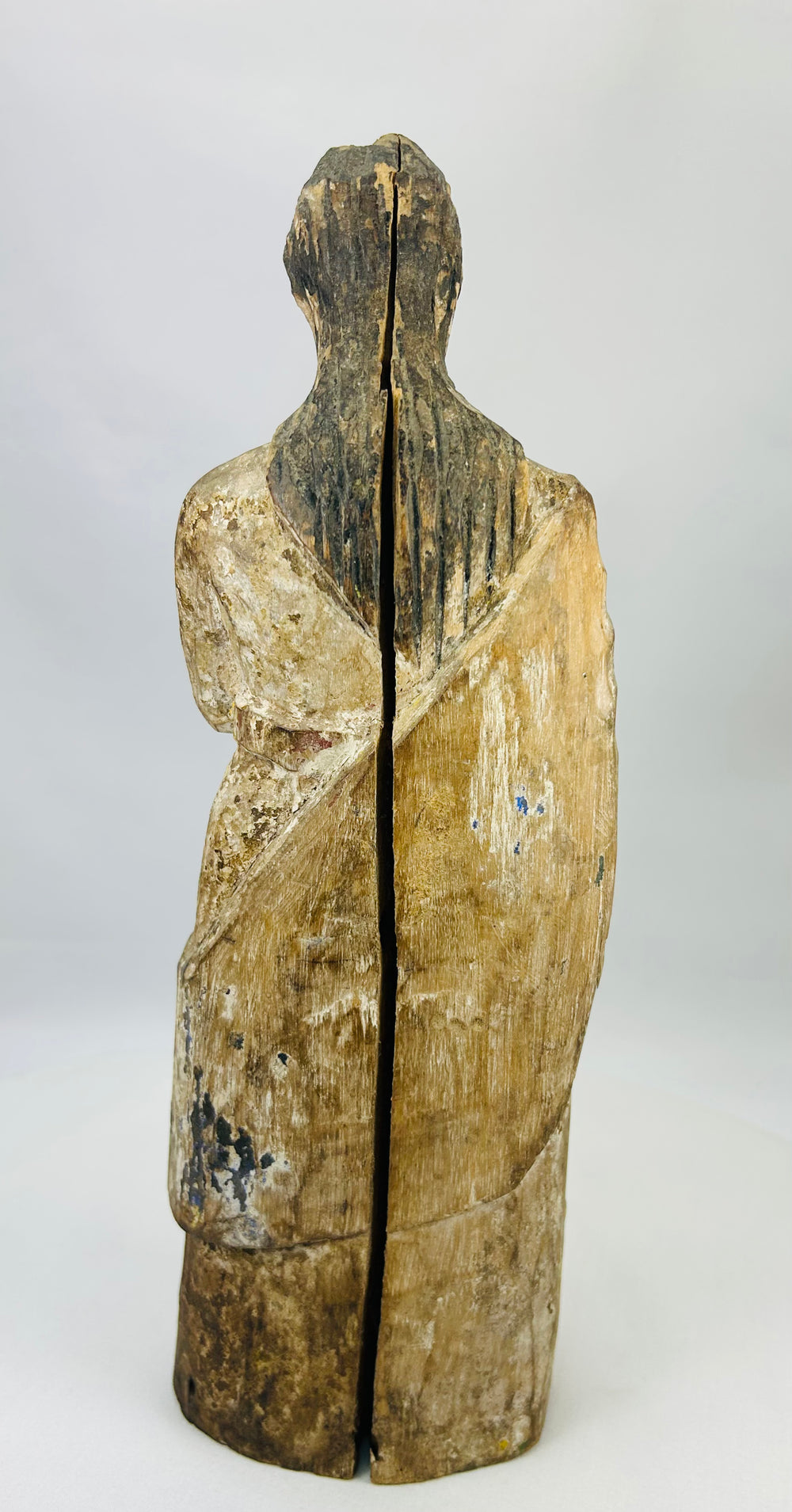 Antique Catholic Santos statue showing centuries of veneration and ritual wear