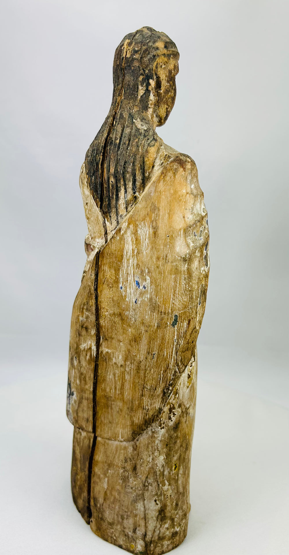 Carved wooden Virgin Mary Santos with forward-held hands and hollowed socket