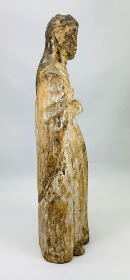 Historic Spanish religious sculpture with expressive face and beautifully aged surface