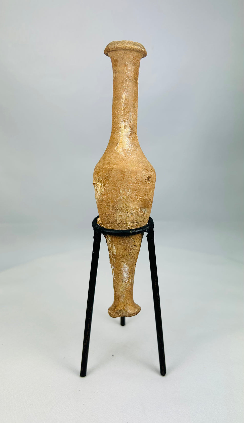 Roman Imperial terracotta oil and perfume bottle with narrow neck and aged archaeological patina