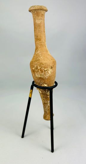 Museum-quality Roman terracotta perfume vessel displaying spindle form and burial encrustation