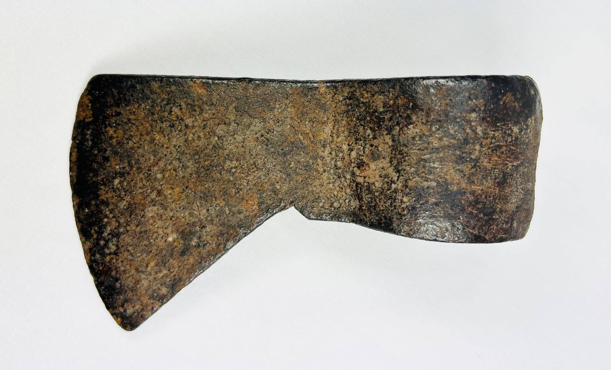Canadian Fur Trade era axe head featuring classic trade profile and archaeological surface