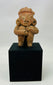 Ancient Nayarit or Jalisco terracotta shaft-tomb figure in protective seated pose, 300 BCE–300 CE