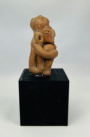 Authentic Pre-Columbian funerary figure with defined brow, almond-shaped eyes, and ceremonial presence