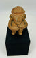 Ancient Mesoamerican terracotta figure with ritual seated pose and subtle traces of original pigment