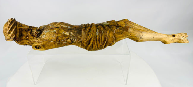 Early Colonial wooden religious figure with defined torso carving and surviving painted surface traces