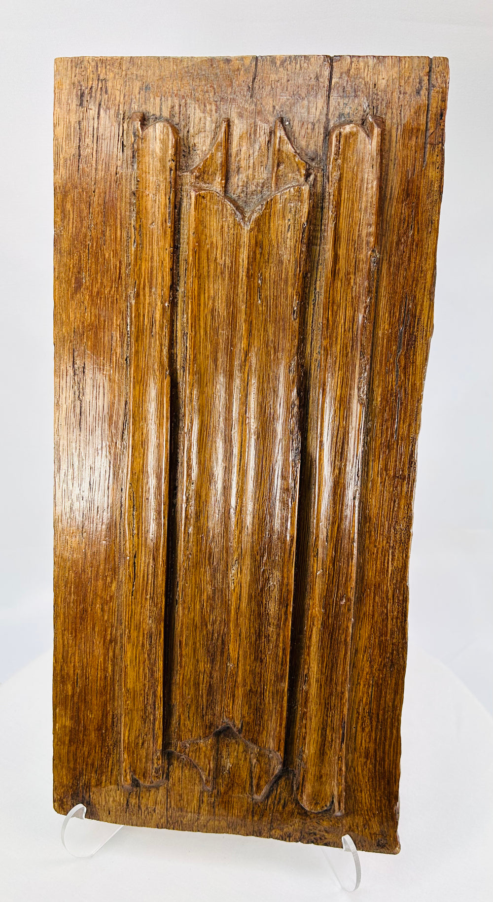 Early Renaissance carved oak panel with stylized trefoil design and ecclesiastical style carving
