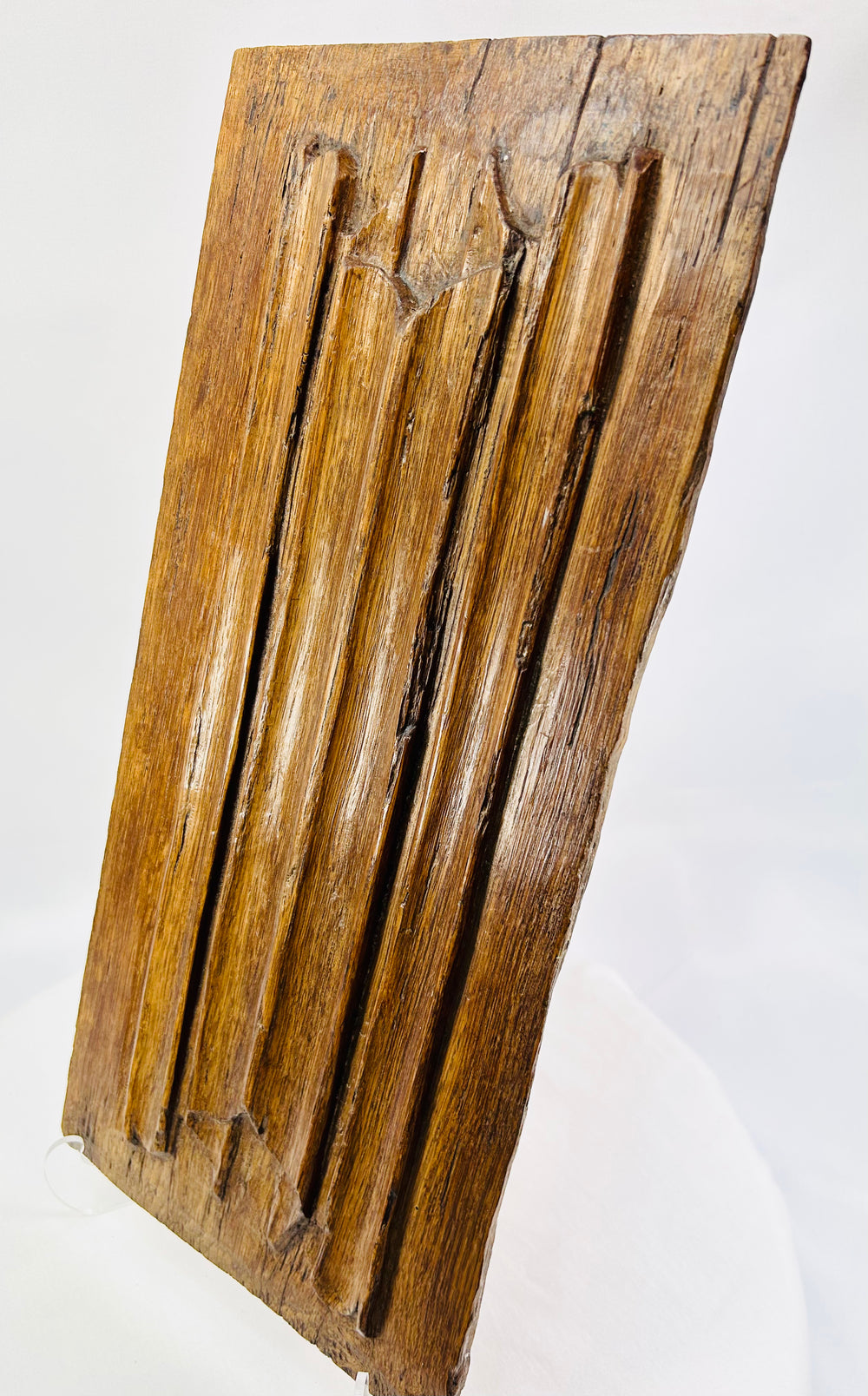 Close-up of 16th-century Gothic oak panel highlighting tooling marks and historic patina