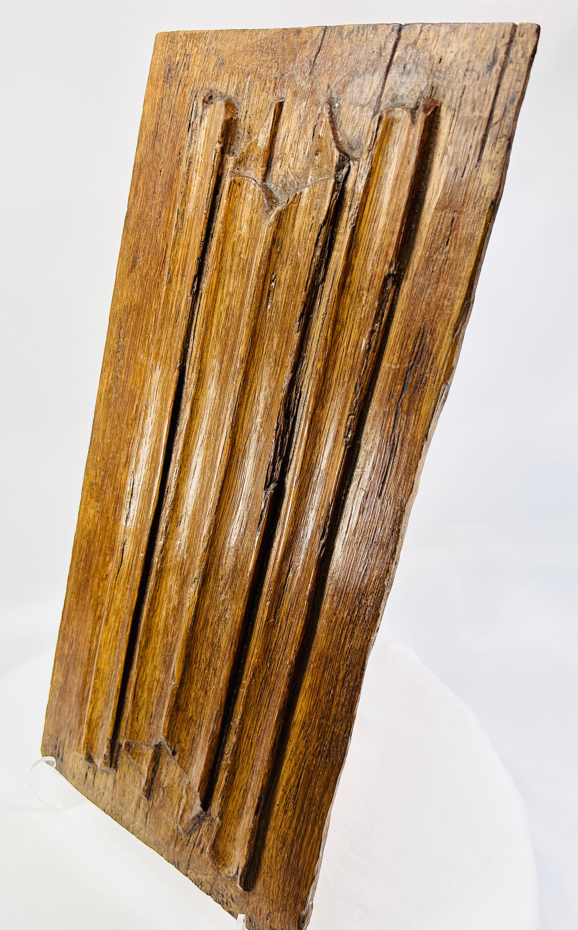 Close-up of 16th-century Gothic oak panel highlighting tooling marks and historic patina