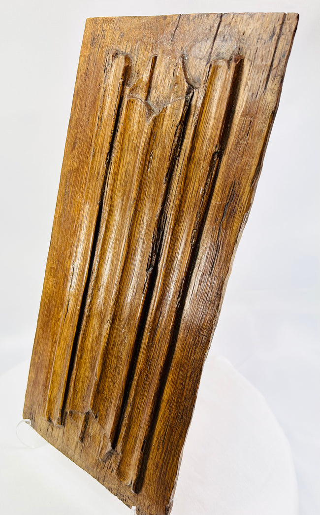 Close-up of 16th-century Gothic oak panel highlighting tooling marks and historic patina