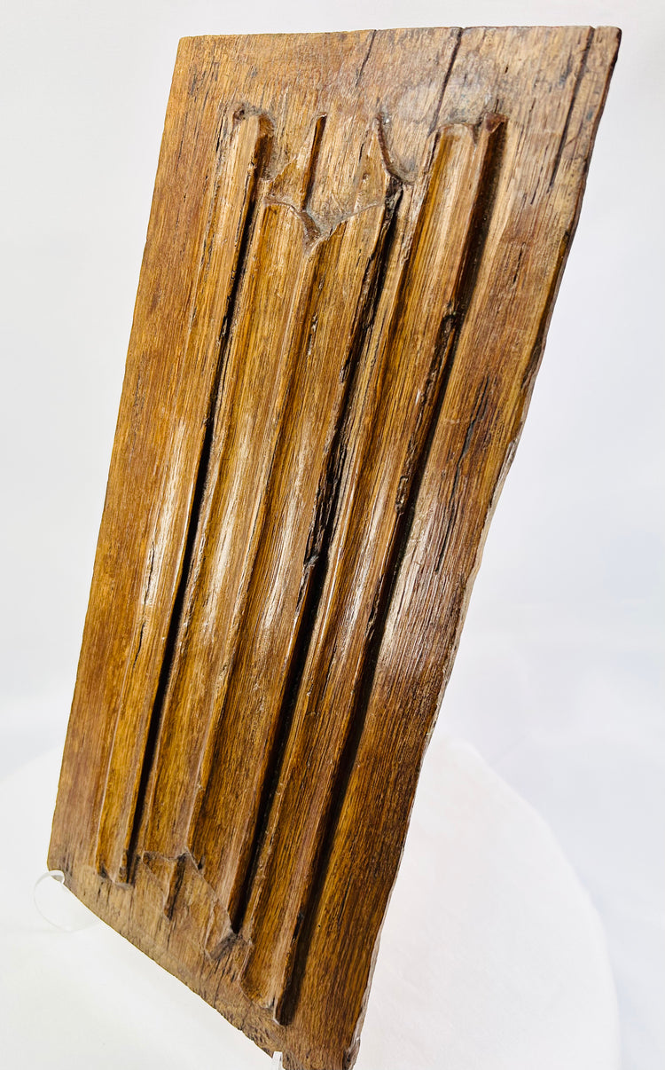 Close-up of 16th-century Gothic oak panel highlighting tooling marks and historic patina