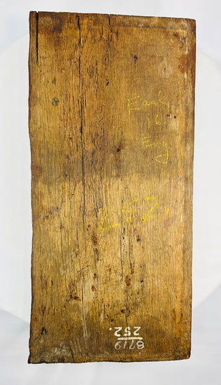 Back view of european 1500s carved oak panel displaying pointed arches and decorative fluted carving